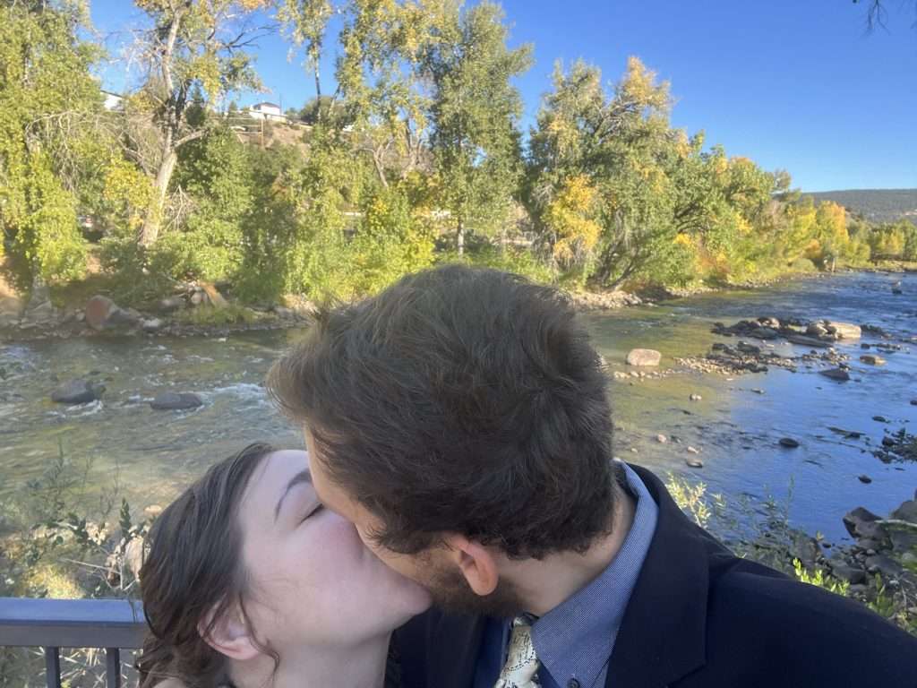 Kissing by the Durango river after getting out of OpenSky