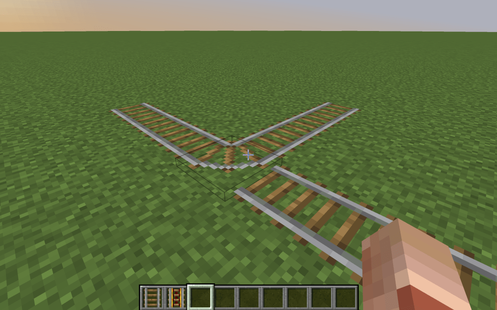 Place down the Minecraft railroad switch track that connects all three lines